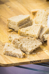 Pieces of fresh traditional wheat or rye bread on stall or in bakery