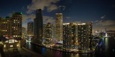 Fototapeta na wymiar Aerial view of downtown district of of Miami Brickell in Florida, USA. Brightly illuminated high skyscraper buildings in modern american midtown