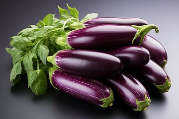 Purple eggplants with basil on a black background closeup