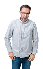 Handsome middle age elegant senior man wearing glasses over isolated background depressed and worry for distress, crying angry and afraid. Sad expression.