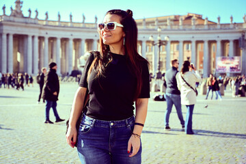 Rome,Italy, Vatican City, Rome, Saint Peter's Basilica in St. Peter's Square  Young beautiful woman...