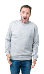 Fototapeta premium Handsome middle age senior man wearing a sweatshirt over isolated background In shock face, looking skeptical and sarcastic, surprised with open mouth