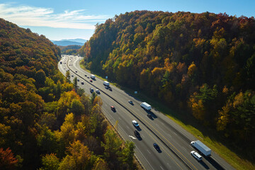 I-40 freeway road leading to Asheville in North Carolina over Appalachian mountain pass with yellow...