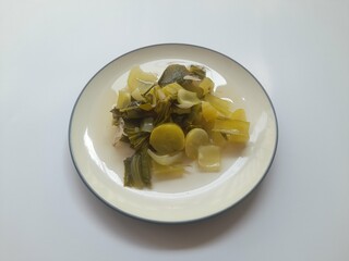 Mustard greens (sayur bening) food on plate top view on white background. background concept of healthy food, food recipes, breakfast, diet, organic, nutritious, nutrition,restaurant,cuisine,lifestyle