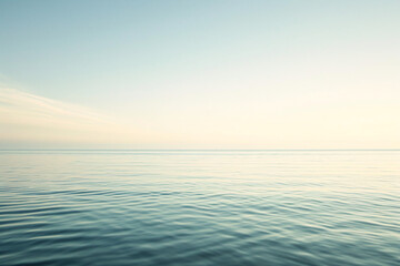 Fototapeta premium Calm ocean horizon at dawn with a clear sky