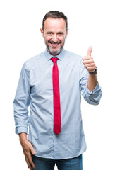 Middle age hoary senior business man wearing red tie over isolated background doing happy thumbs up gesture with hand. Approving expression looking at the camera with showing success.