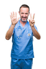 Middle age hoary senior doctor man wearing medical uniform over isolated background showing and pointing up with fingers number seven while smiling confident and happy.