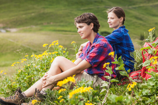 girlfriends relaxing in the mountains enjoying the view
