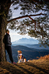 spending time with a dog during a mountain hike