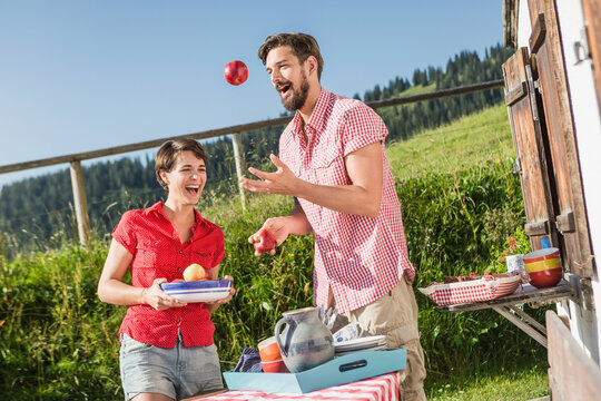 family and friends having a picnic in the mountains at at cabin