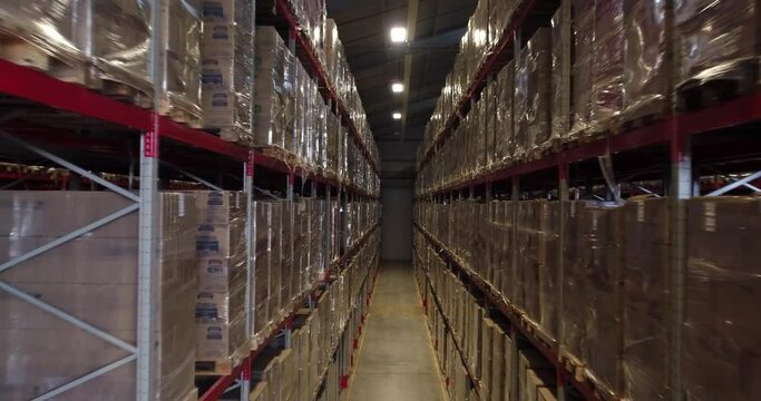 Inside view of a large warehouse with shelves and rows of shelves.