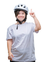 Young adult cyclist woman with down syndrome wearing safety helmet over isolated background pointing finger up with successful idea. Exited and happy. Number one.