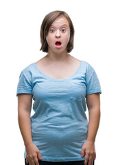 Fototapeta premium Young adult woman with down syndrome over isolated background afraid and shocked with surprise expression, fear and excited face.