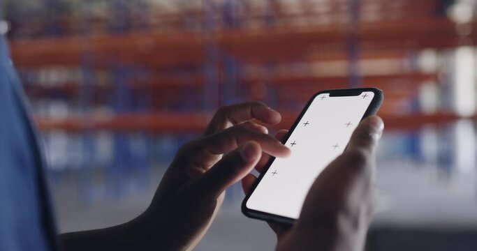 Phone screen, mockup and hands of man in warehouse for architecture, engineering or communication. Factory, social media or mobile app with closeup of contractor for chroma key, networking or message
