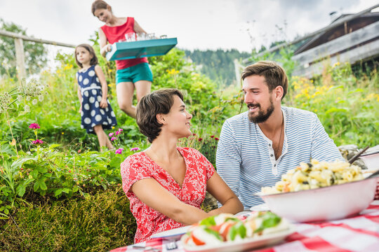 happy family in the garden in the mountains