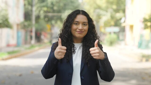 Curly Hair Indian Businesswoman Showing Thumbs Up