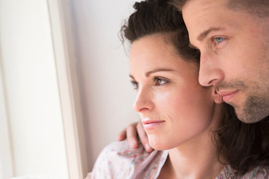 cute couple in love close up looking out of the window