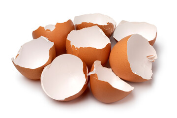 Heap of brown empty egg shells close up isolated on white background