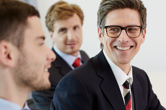 cheerful lawyers meeting in law office close up