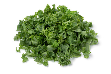 Heap of fresh cut green curly kale close up isolated on white background