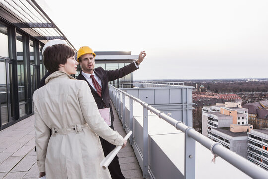 developer and owners of new building inspecting the progress
