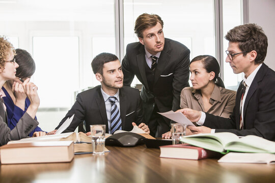 cheerful lawyers meeting in law office 
