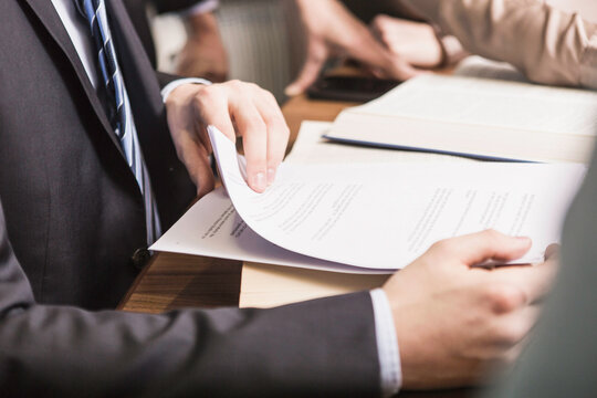 close up hands meeting in law office 