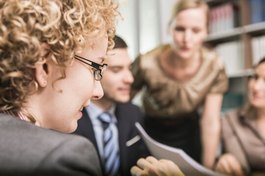 cheerful lawyers meeting in law office 