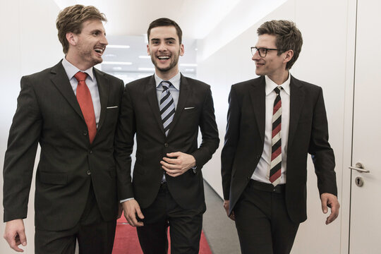 portrait of business team walking down a hall