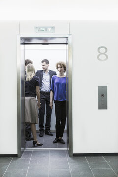 Business people in elevator