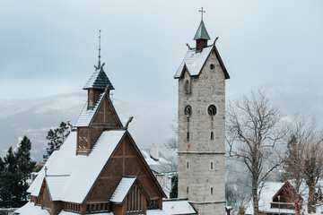 Fototapeta na wymiar Wang Temple in Karpacz in a winter scenery in Poland in Karkonosze Mountains