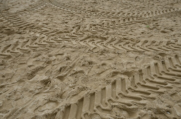 Tractor tracks on sand of Marbella beach , Andalusia, Spain..
