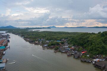 Aerial view of Ranong City, The Floating village urban city town houses, lake sea or river. Nature landscape fisheries and fishing tools, Thailand. Aquaculture farming