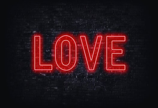 Illuminated love sign with bright glowing neon lights - a vibrant display of affection and romance, valentine's day