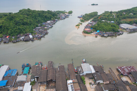 Aerial view of Ranong City, The Floating village urban city town houses, lake sea or river. Nature landscape fisheries and fishing tools, Thailand. Aquaculture farming