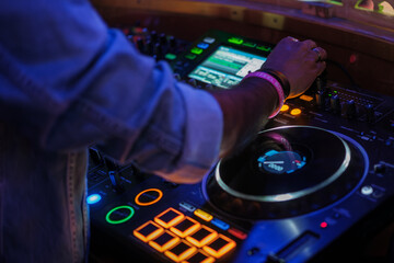 DJ hands playing special bollywood music at a theme party. Concept: fun, music