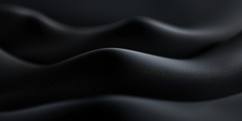 Obraz premium High-definition shot of a textured black fabric with smooth wavy patterns creating a sense of elegant movement and depth.