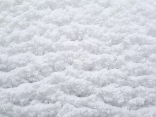 Snow on the roof of a car in winter. Close-up