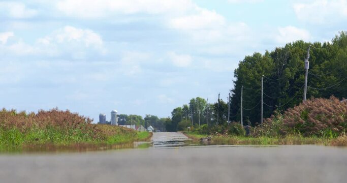 Heat waves with car approaching on rural road