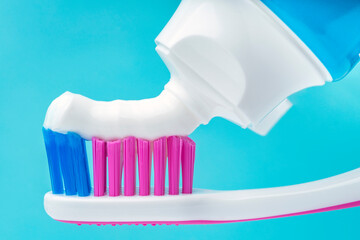 Close up of toothpaste tube putting paste on toothbrush. Brush the teeth for dental healthcare.