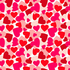 Red, pink and burgundy hearts randomly on a white background. Seamless pattern, print, vector illustration