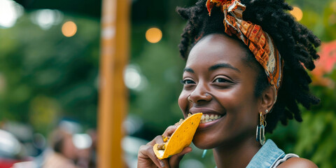 Cheerful Young Woman Eating a Taco at a Vibrant Outdoor Market