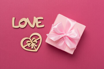 Valentines day composition with gifts on color background, top view.