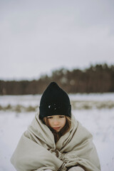 a little girl who was cold and wrapped in a warm scarf