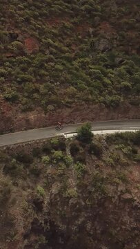 Epic Routes in the Canary Islands, Cyclists in the Mountains, difficult roads in Gran Canaria, vertical drone recorded cycling in 4k quality