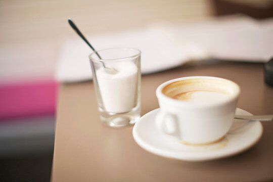 Still of an empty coffee cup in a coffee shop