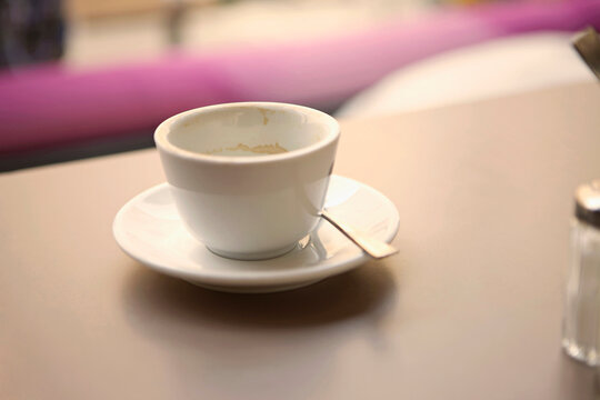 Still of an empty coffee cup in a coffee shop