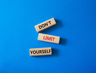 Do not limit yourself symbol. Concept words Do not limit yourself on wooden blocks. Beautiful blue background. Business and Do not limit yourself concept. Copy space
