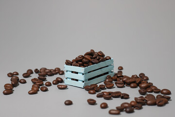 coffee beans lie in multi-colored wooden boxes