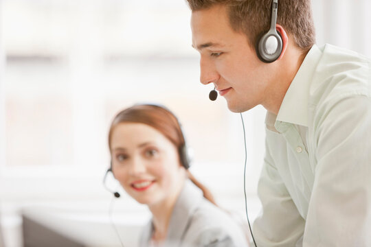 Colleagues working in a call center with a very friendly atmosphere. Munich, Germany